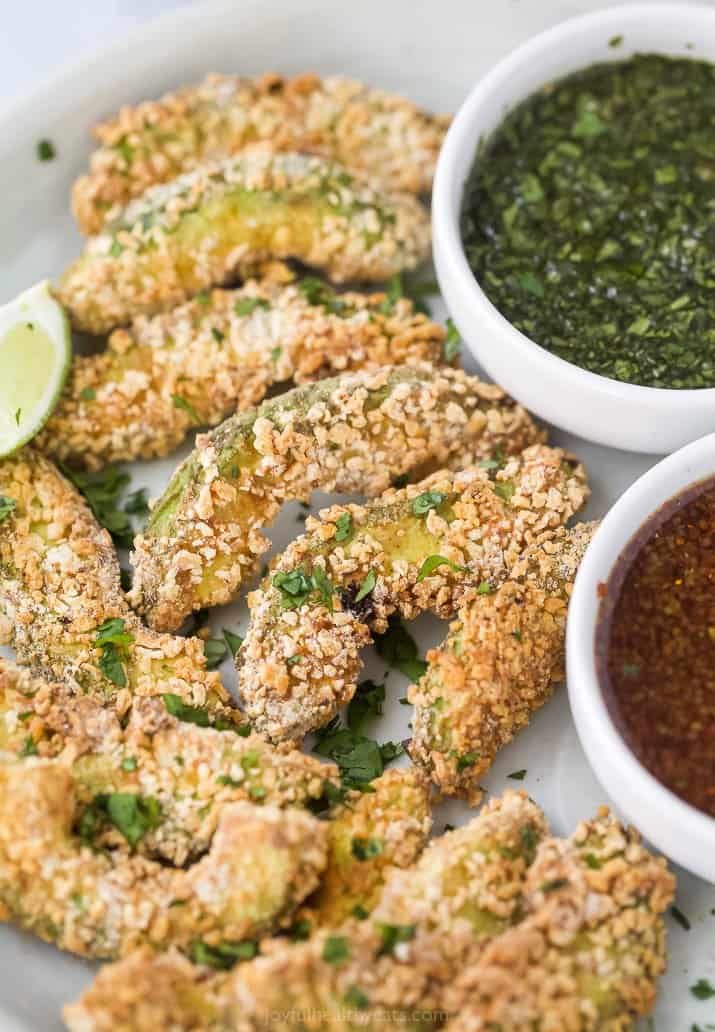 avocado fries on a plate with cilantro lime sauce