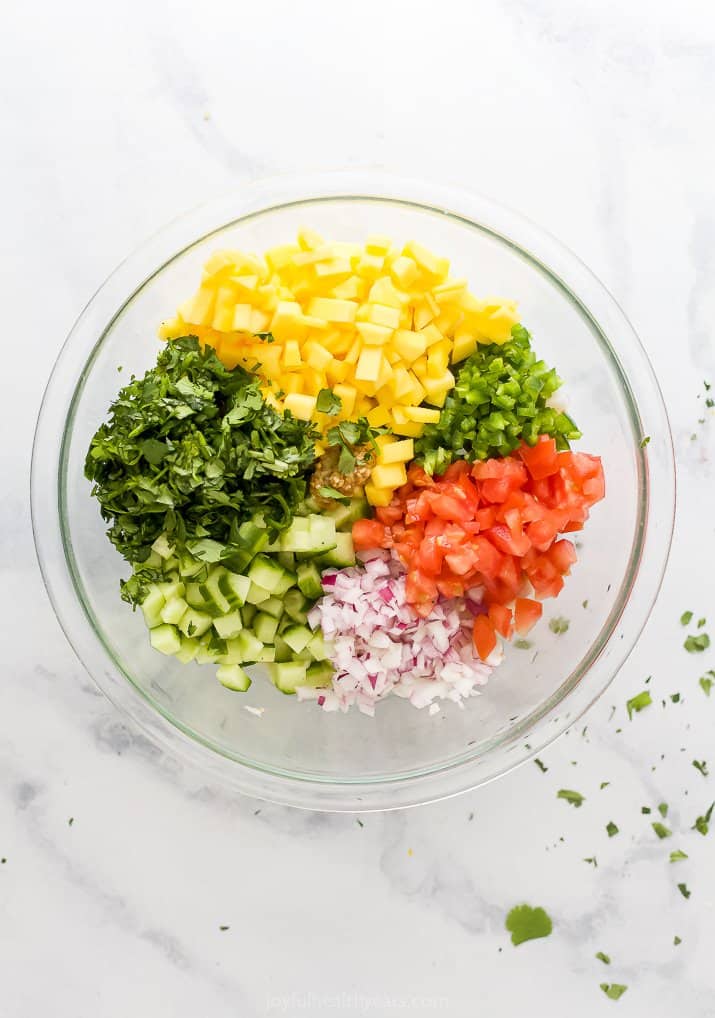 marinated shrimp with fresh vegetables on top