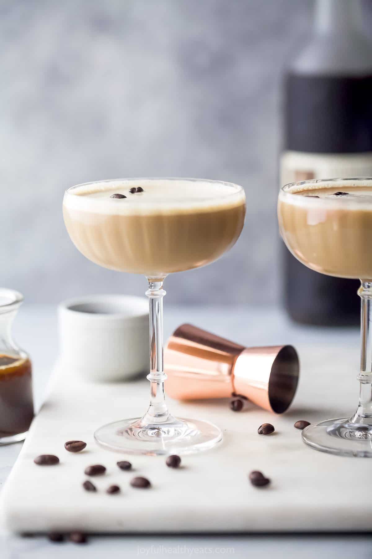 A chilled Espresso Martini made with espresso, coffee liquor, vodka and Bailey's for one smooth sip! The perfect after-dinner holiday drink. glass filled with espresso martini