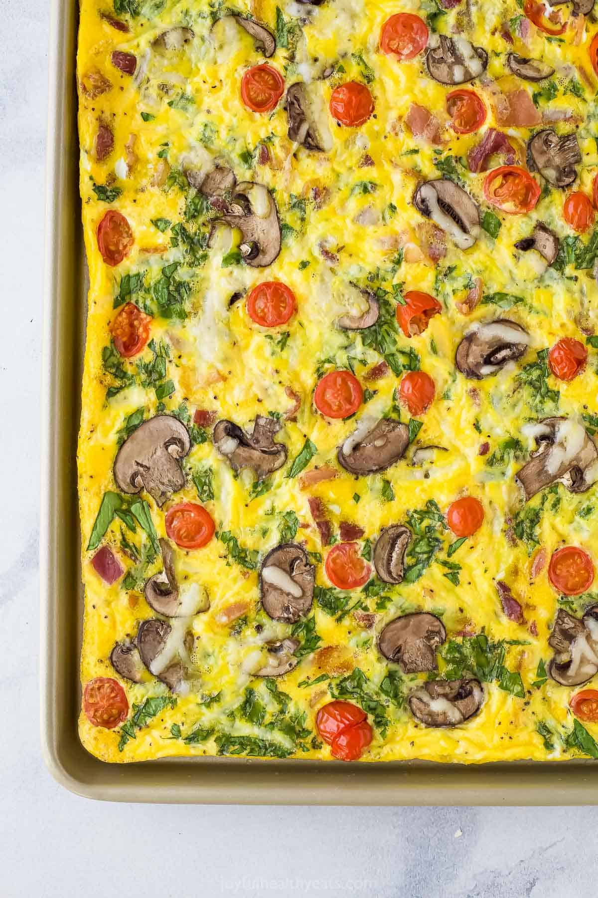 A close-up shot of a mushroom and spinach breakfast frittata