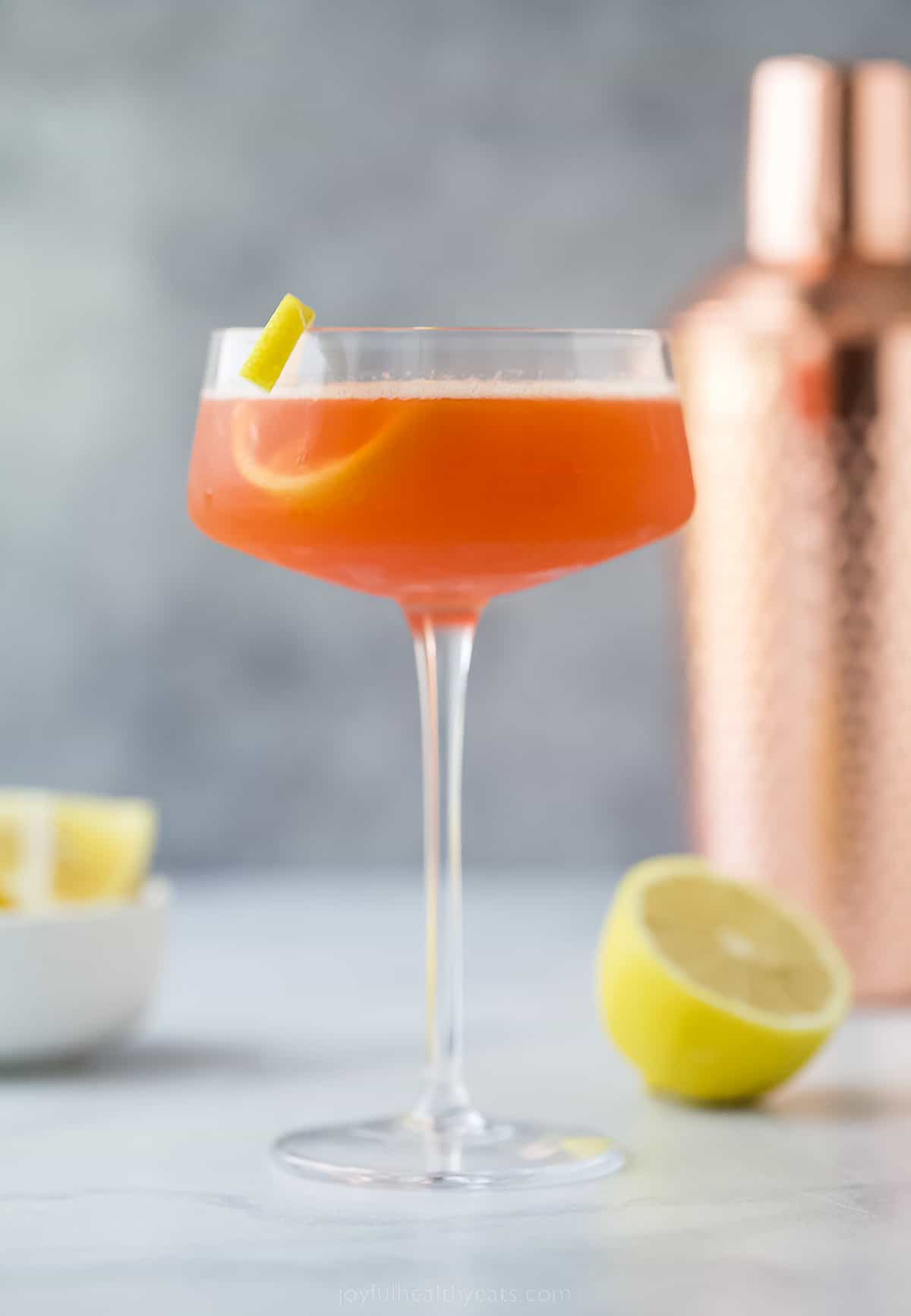 This Paper Plane Cocktail has just bourbon, Aperol, Amaro Nonino, and freshly squeezed lemon juice. It's chic, simple, and sophisticated! A paper plane cocktail with lemon garnish