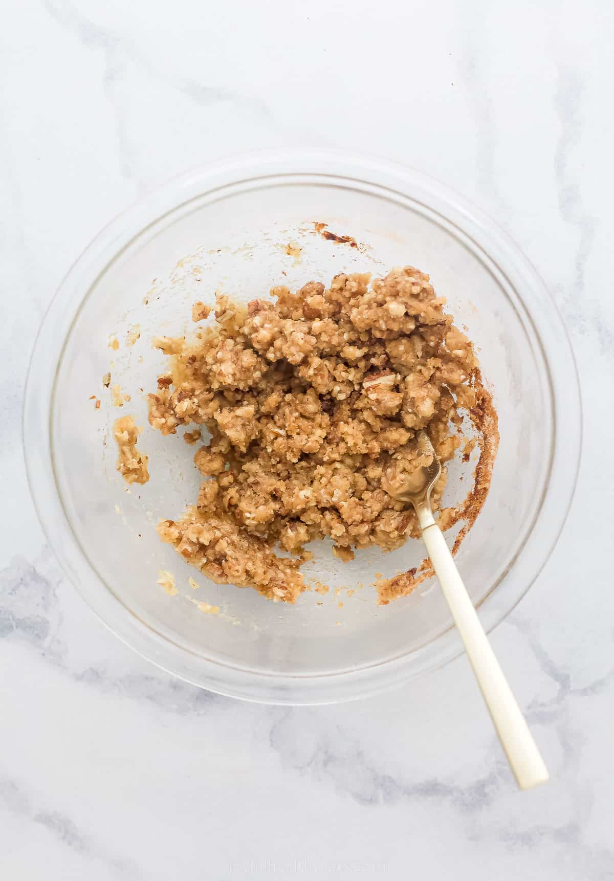 cinnamon pecan streusel in a bowl with a spoon