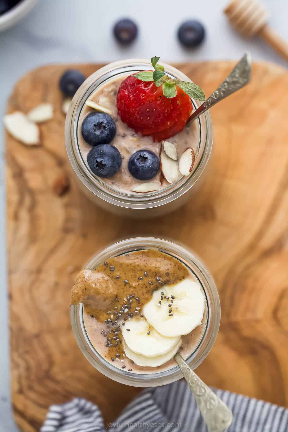 These simple Protein Overnight Oats are a great make-ahead breakfast. These flavorful oats have vanilla protein powder, banana, and cinnamon. two jars of high protein overnight oats