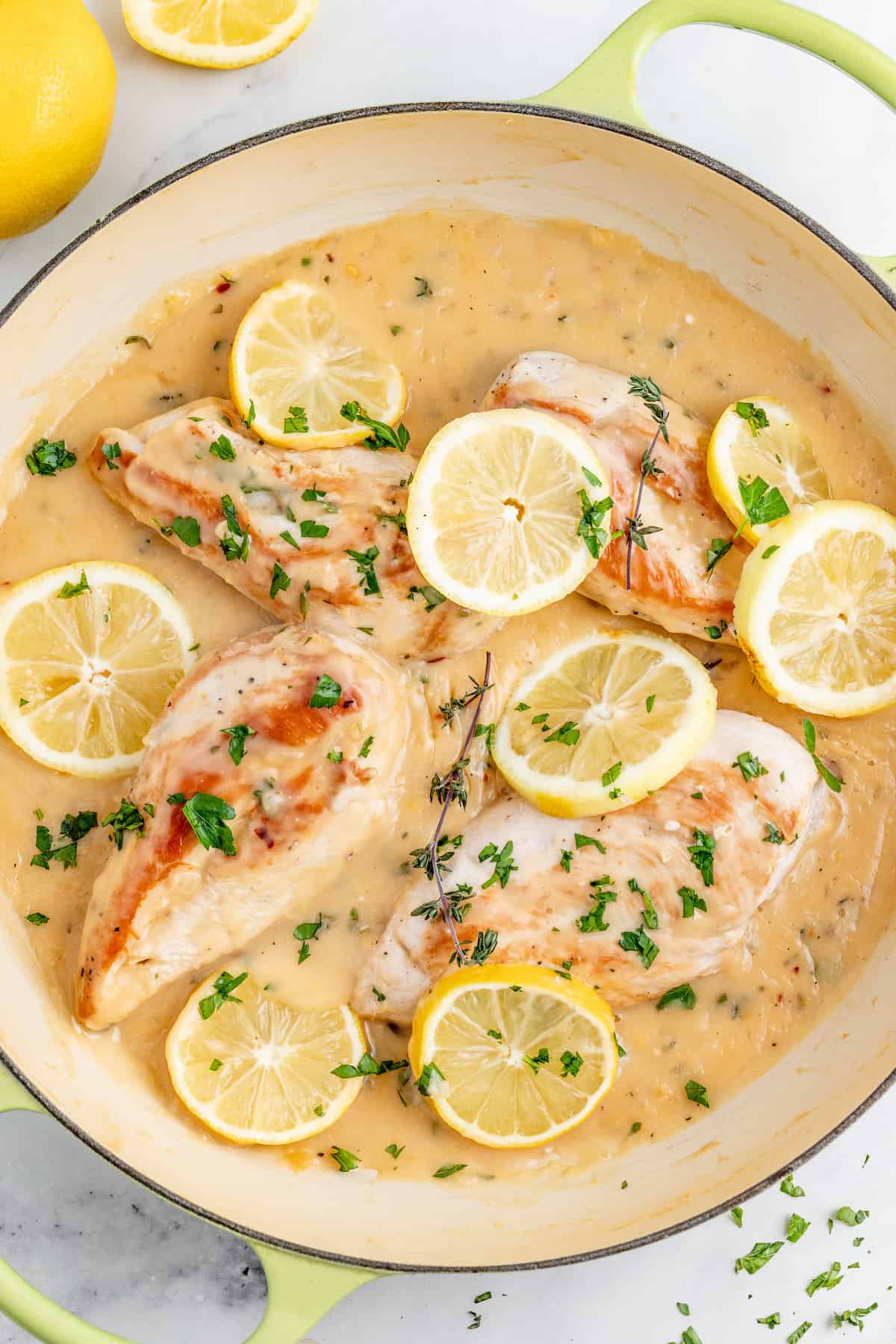 This juicy lemon chicken in a buttery garlic sauce will be your new favorite way to cook chicken. It's herby, garlicky, spicy, and zesty! Lemon chicken in the pan.