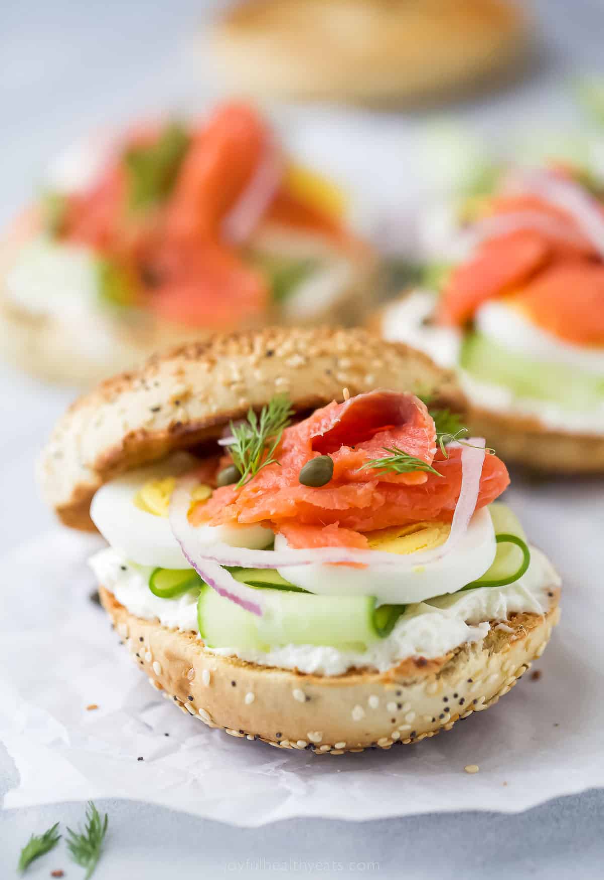 Topped with cream cheese, this bagel and lox recipe is the perfect 5-minute breakfast. It's crunchy, savory, spicy, and packed with veggies! Assembled bagel and lox.