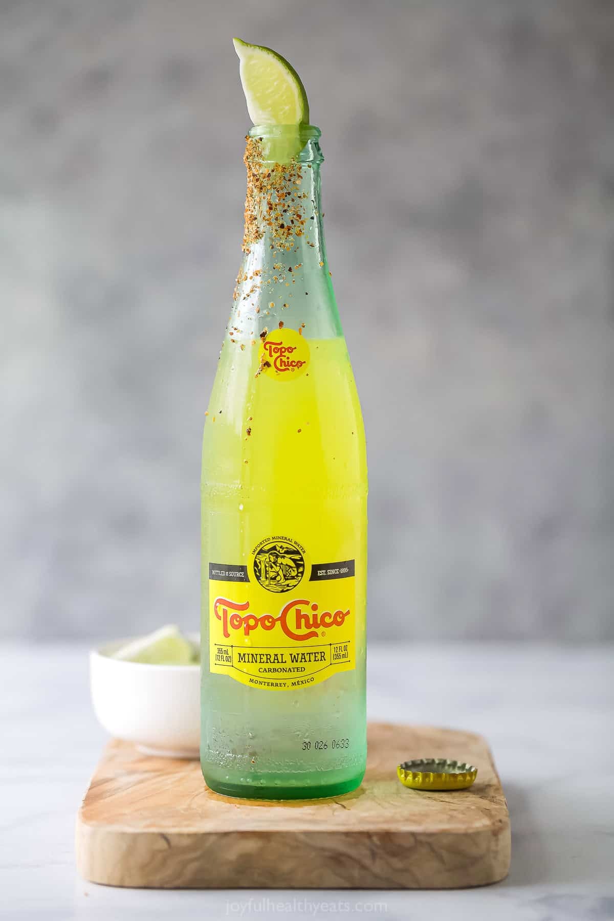 Ranch water recipe with a lime wedge and Tajin rim. 