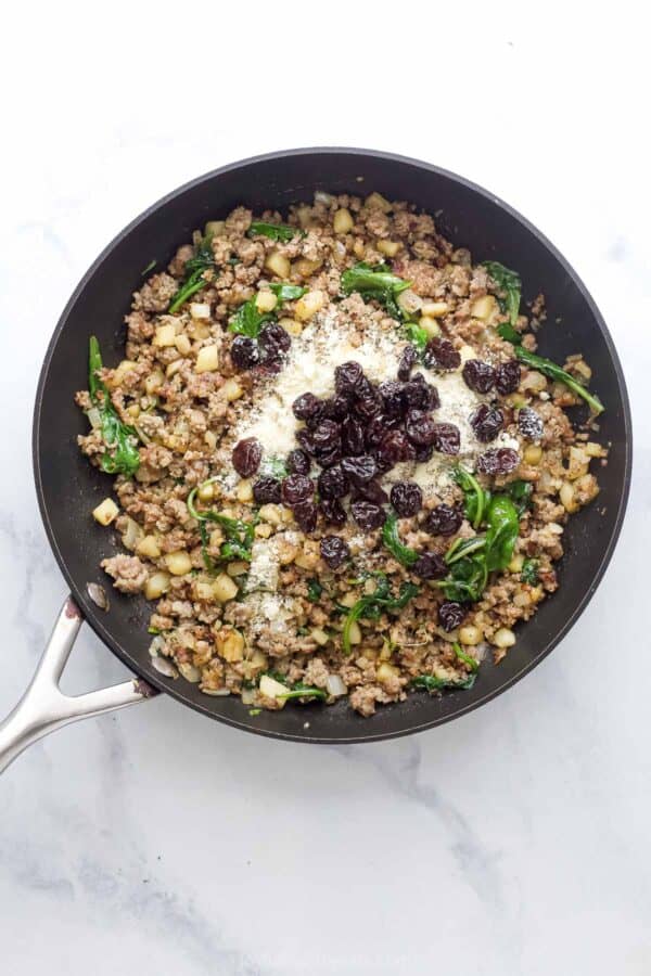 Browned sausage with apples, onions, thyme, cherries, and parmesan cheese.