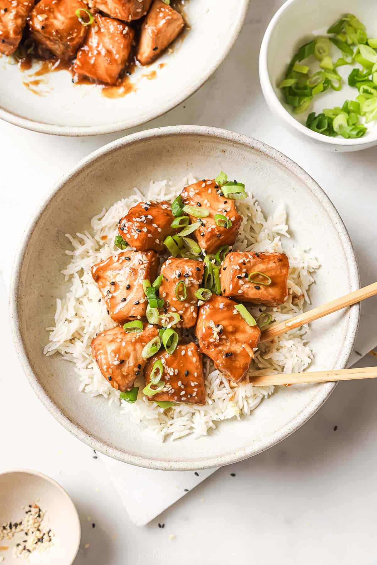Crispy salmon bites in bowl of rice