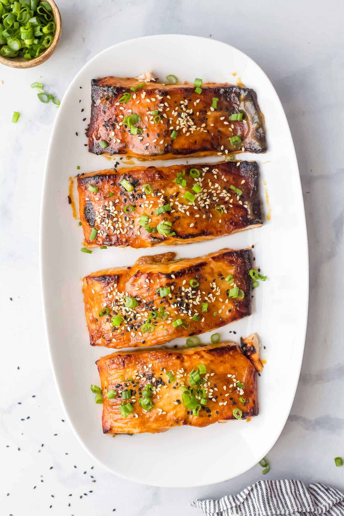 Overhead view of miso salmon on platter