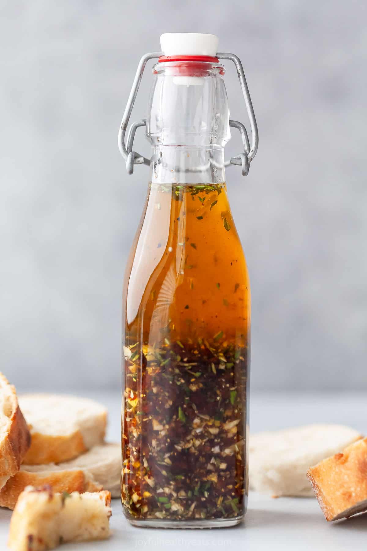 Bread dipping oil in glass bottle