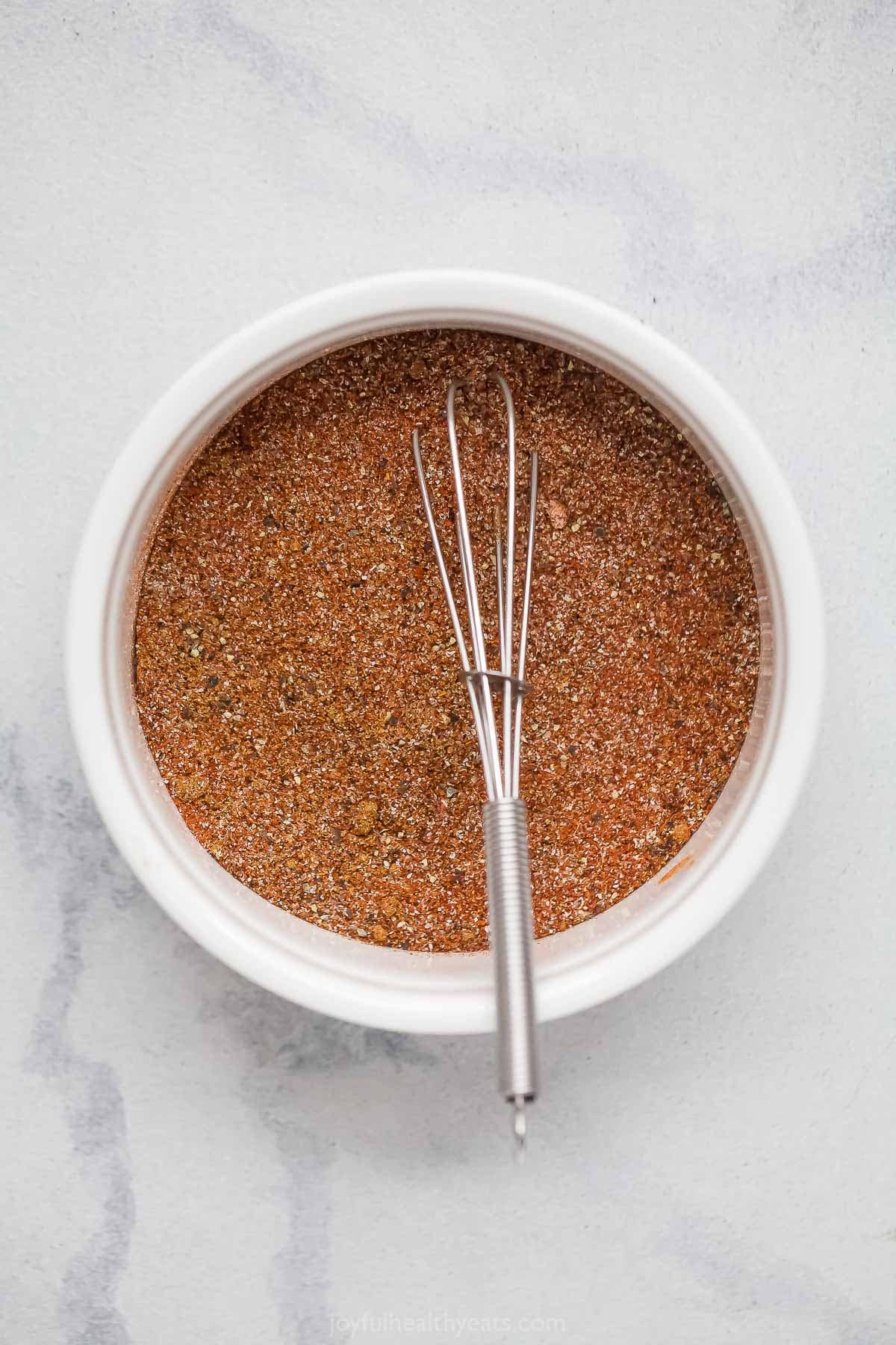 Southwest spice blend in bowl with whisk