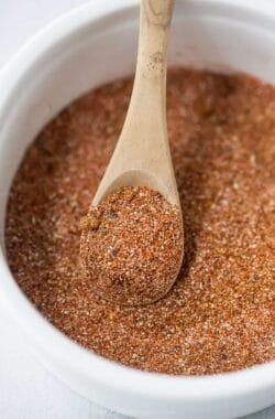 Spoon scooping Southwest spice blend from bowl