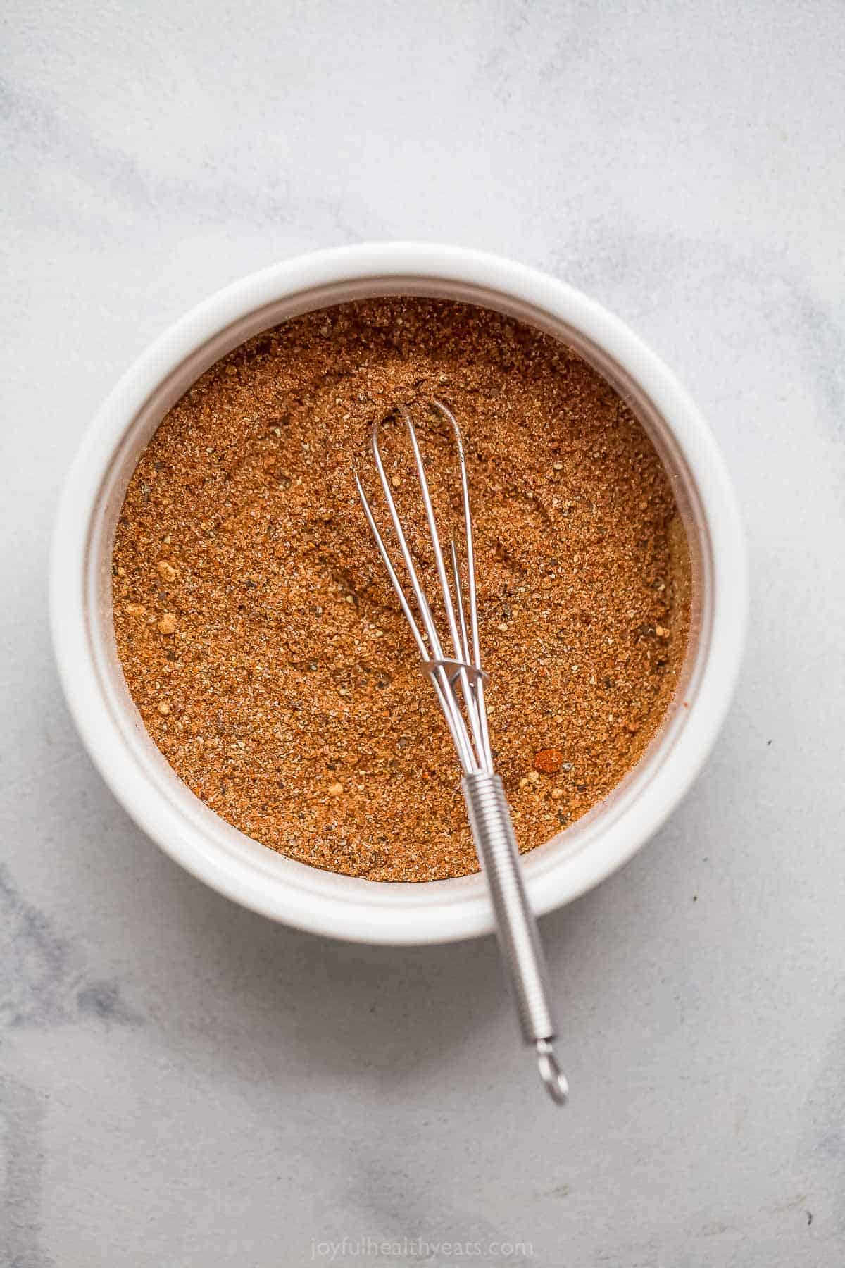 Buffalo chicken spice rub in bowl with whisk