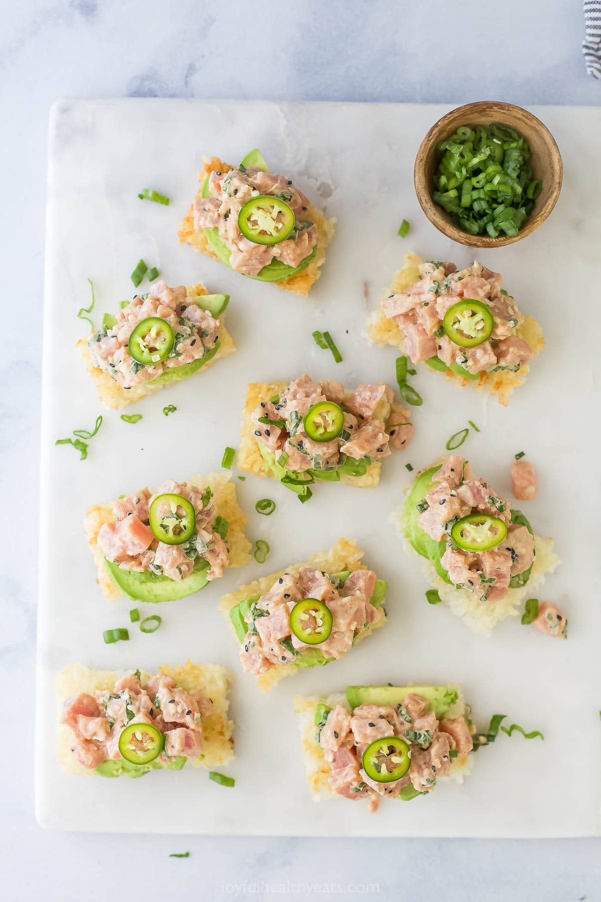 Overhead view of spicy tuna crispy rice bites on board