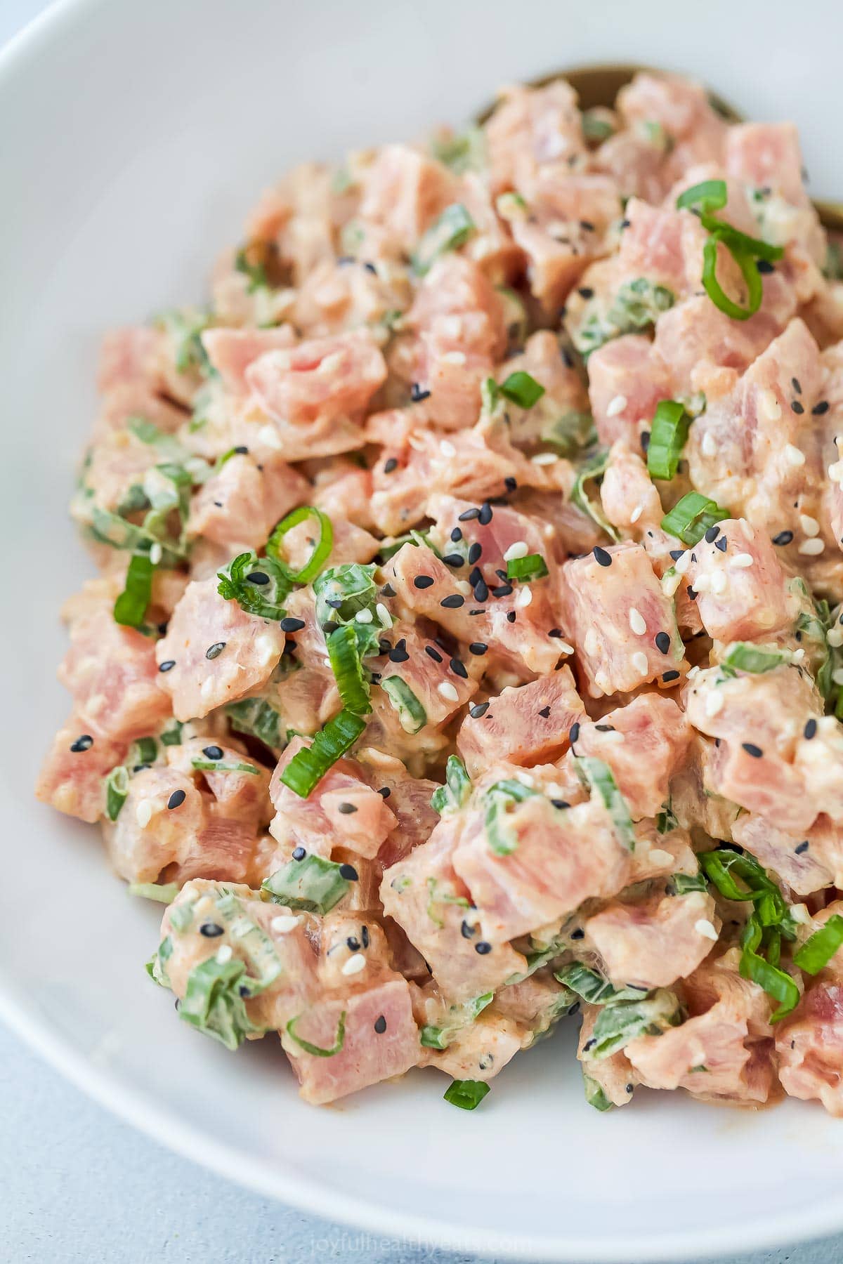 Bowl of spicy tuna with sesame seeds